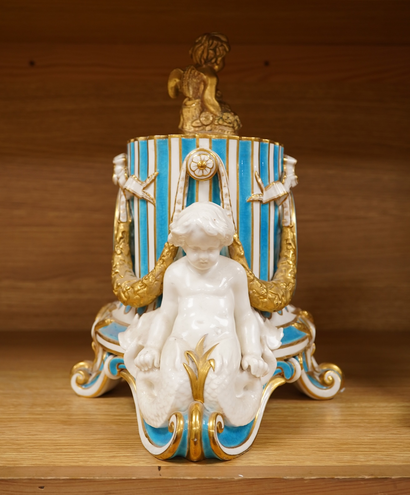 A 19th-century Sevres style porcelain mantel clock, 29cm tall